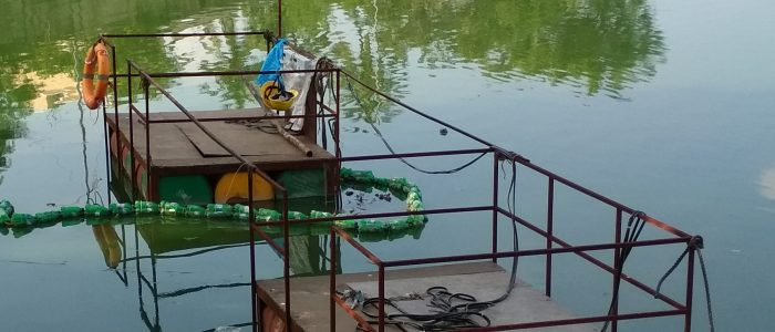 Operation of Submersible dredgers attached to floats at ICF Lake, Villivakkam in Chennai, Tamil Nadu.